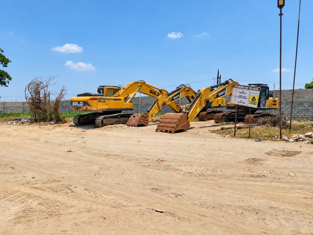 Excavators in the equipment yard at the Shi and Yan mining facility