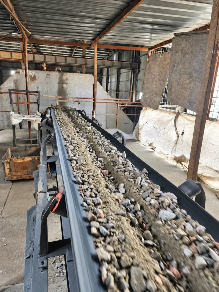 Rock material conveyor at the Shi and Yan mining facility