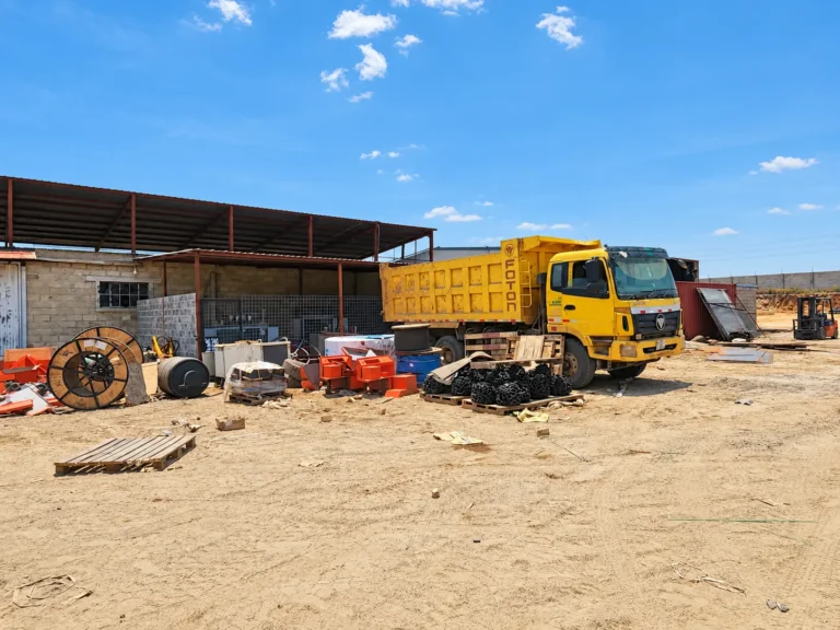 Tipper truck in the workshop yard at the Shi and Yan mining facility